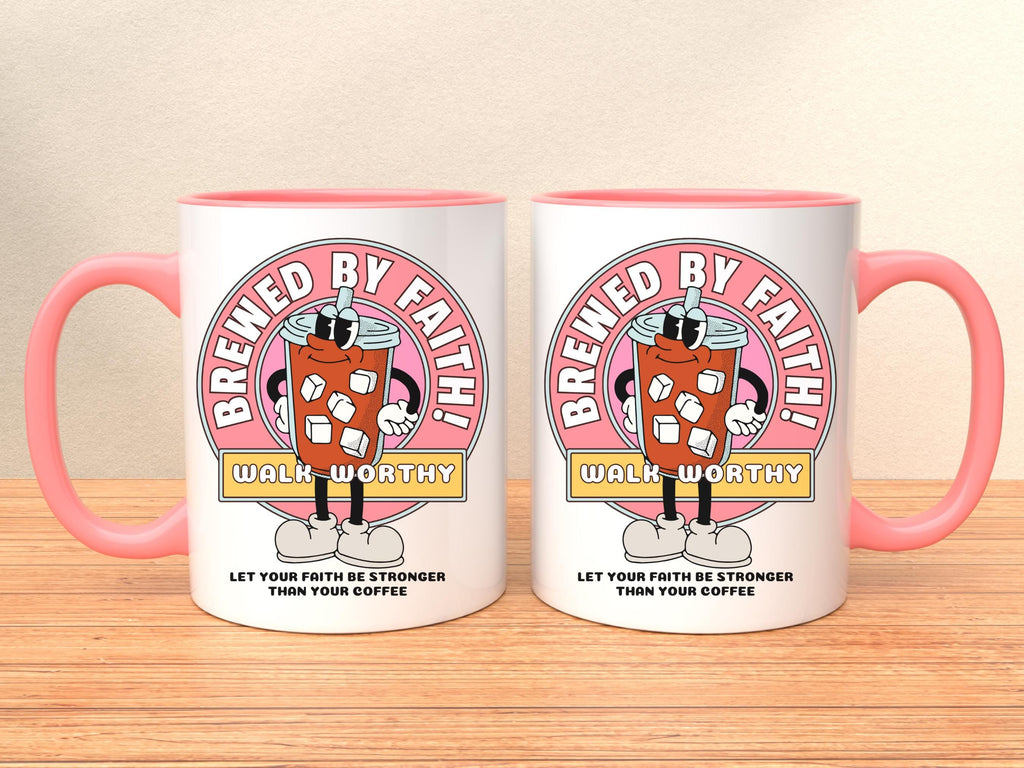 white ceramic mug with pink handle and rim. Mug features a cartoon coffee cup design with the words 'Brewed By Faith!' and 'Walk Worthy' in a pink circle on front and back. The mug also has the text 'Let Your Faith Be Stronger Than Your Coffee'.