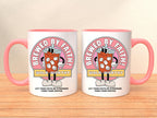 white ceramic mug with pink handle and rim. Mug features a cartoon coffee cup design with the words 'Brewed By Faith!' and 'Walk Worthy' in a pink circle on front and back. The mug also has the text 'Let Your Faith Be Stronger Than Your Coffee'.