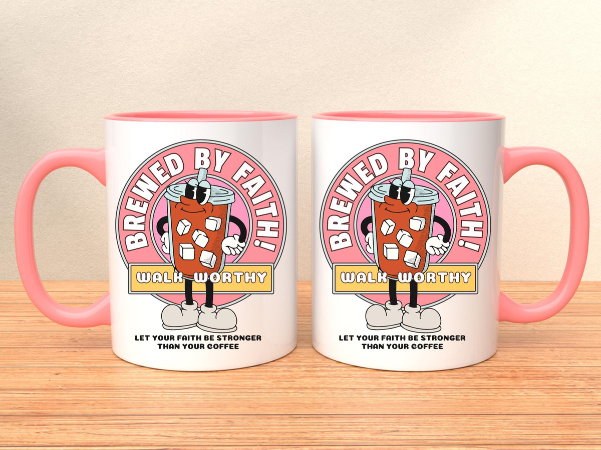 white ceramic mug with pink handle and rim. Mug features a cartoon coffee cup design with the words 'Brewed By Faith!' and 'Walk Worthy' in a pink circle on front and back. The mug also has the text 'Let Your Faith Be Stronger Than Your Coffee'.